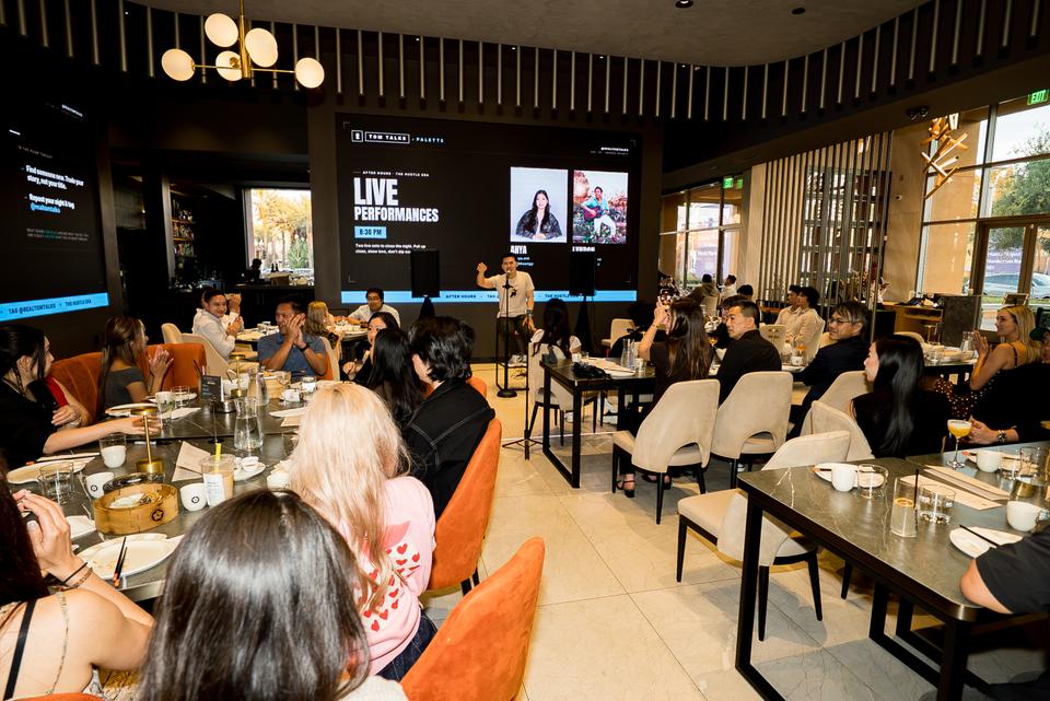 Full room at Tom Talks x Palette with live performances on the big screen