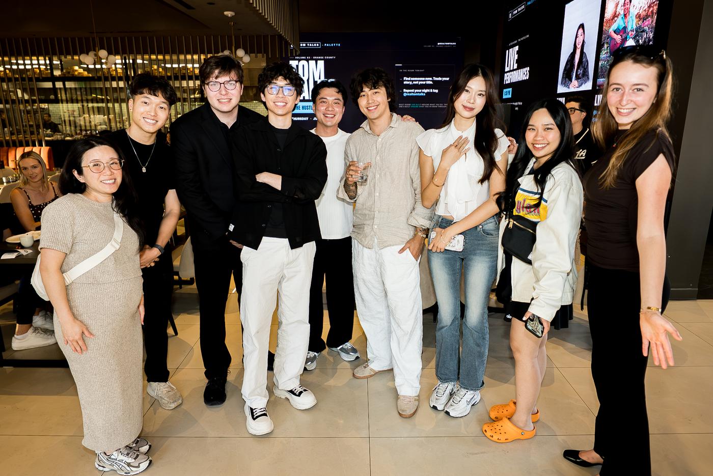 Group photo of builders posing together at a Tom Talks night